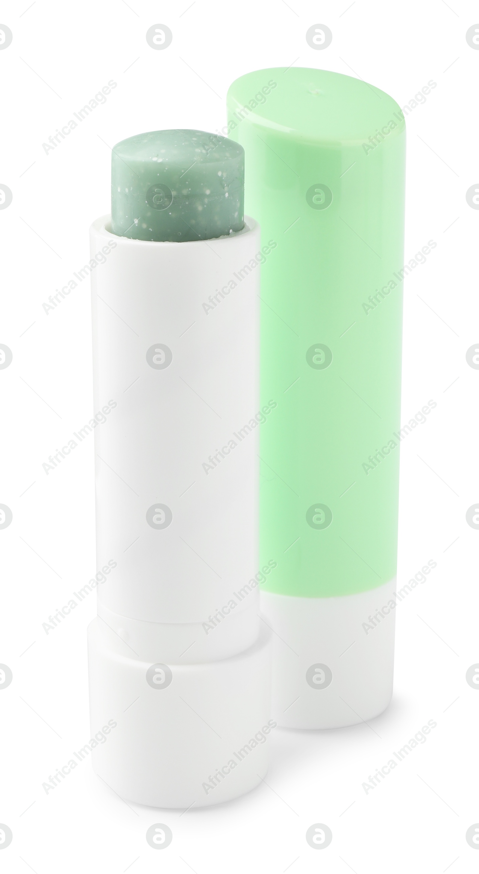 Photo of Lip balms isolated on white. Cosmetic product