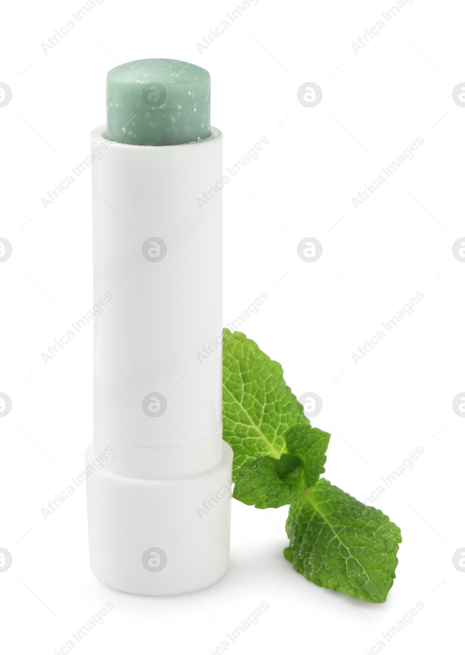 Photo of Mint lip balm and green leaves isolated on white. Cosmetic product