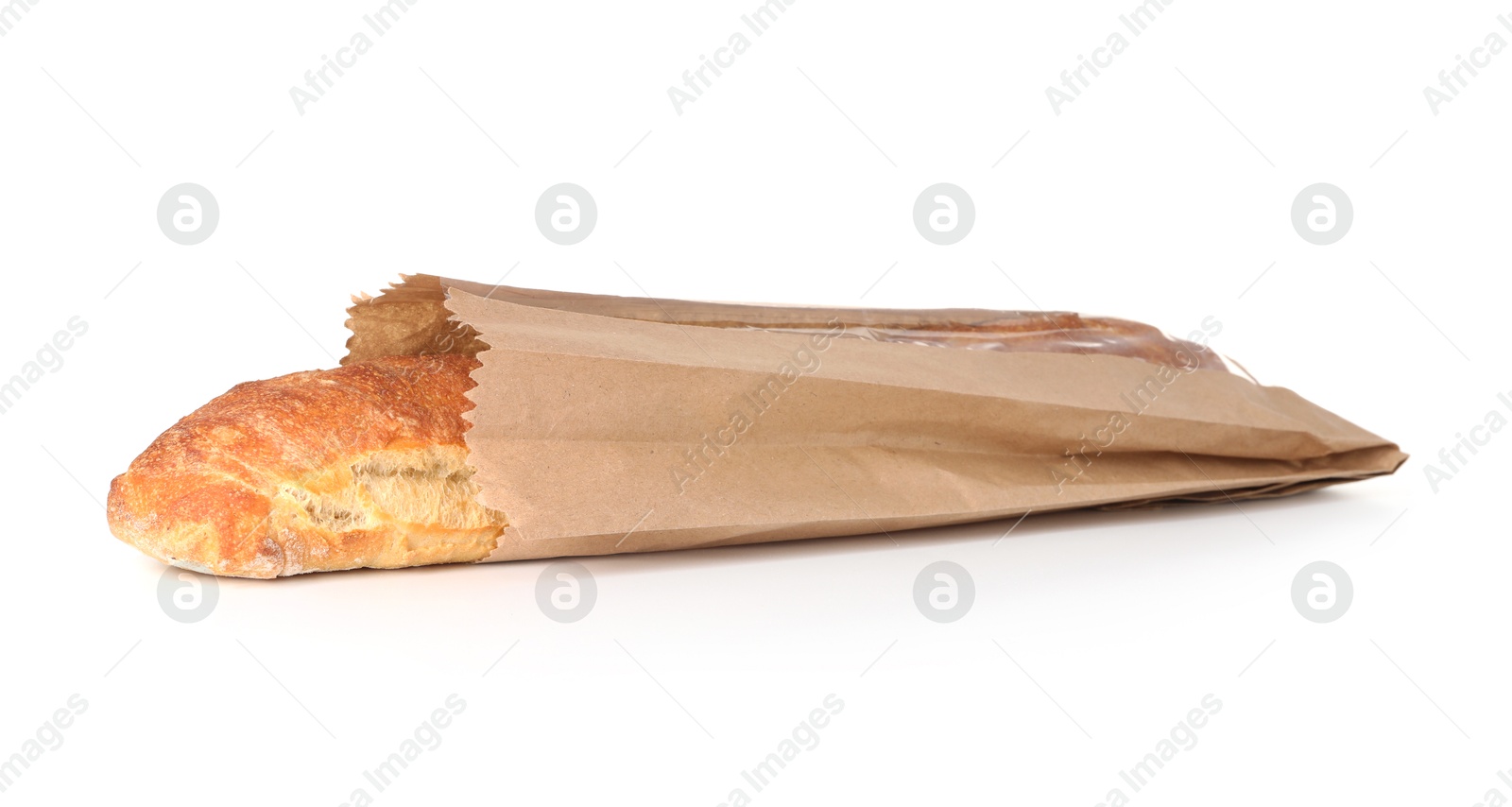 Photo of Fresh baguette in paper bag isolated on white