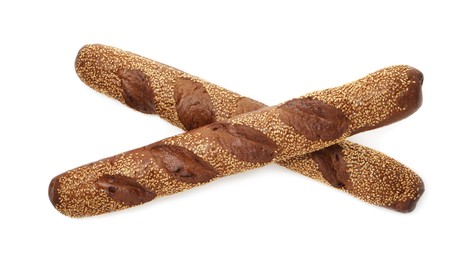 Photo of Fresh baguettes with sesame isolated on white, top view