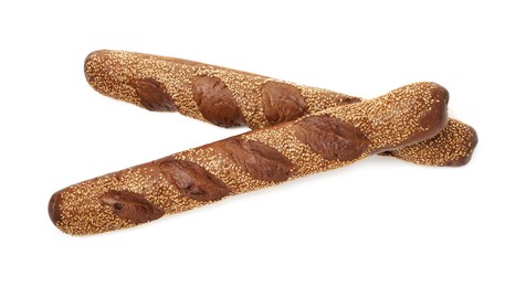 Photo of Fresh baguettes with sesame isolated on white, top view