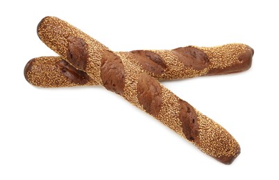 Photo of Fresh baguettes with sesame isolated on white, top view