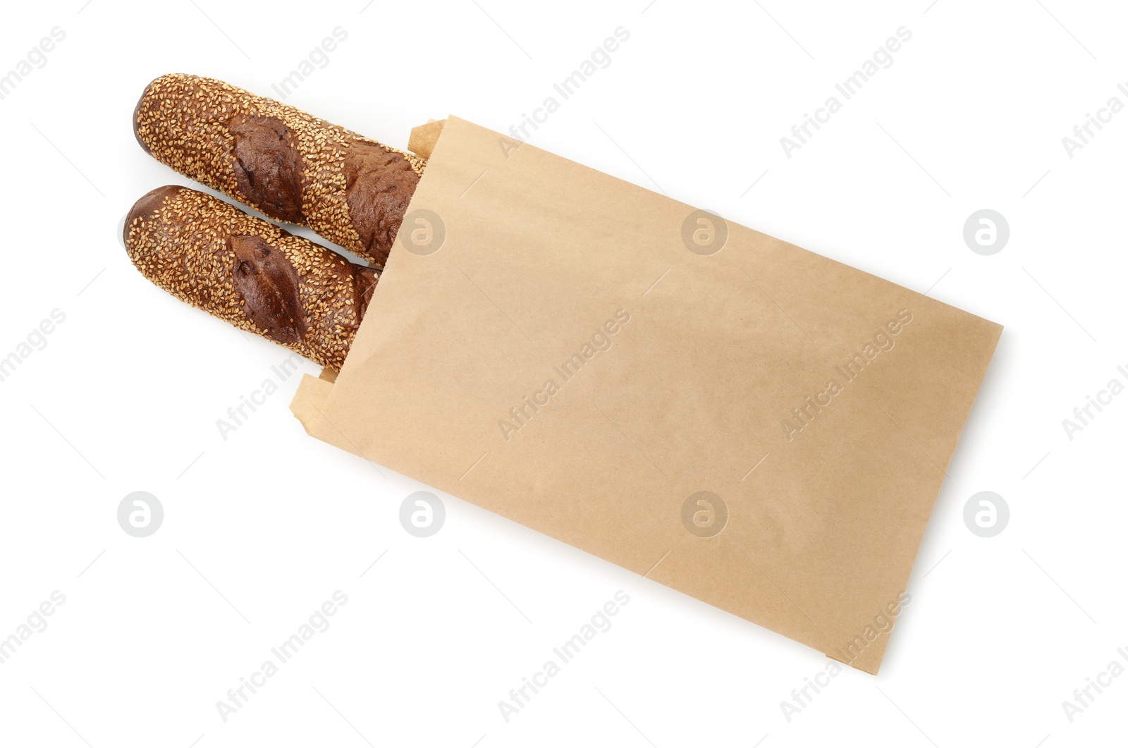 Photo of Fresh baguettes with sesame in paper bag isolated on white, top view