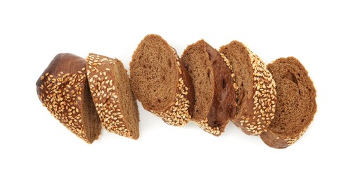 Photo of Pieces of fresh baguette with sesame isolated on white, top view