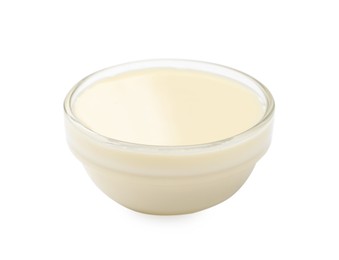 Photo of Condensed milk in bowl isolated on white