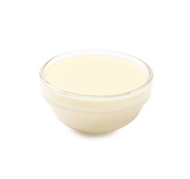 Photo of Condensed milk in bowl isolated on white