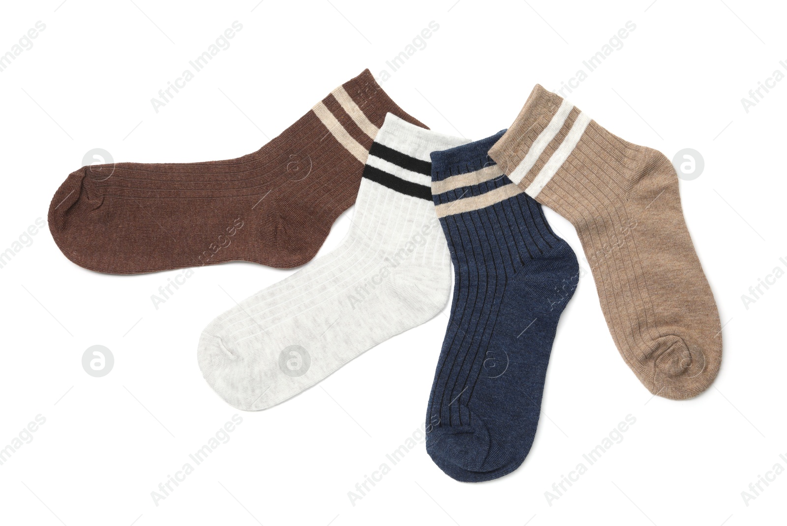 Photo of Different soft socks isolated on white, top view