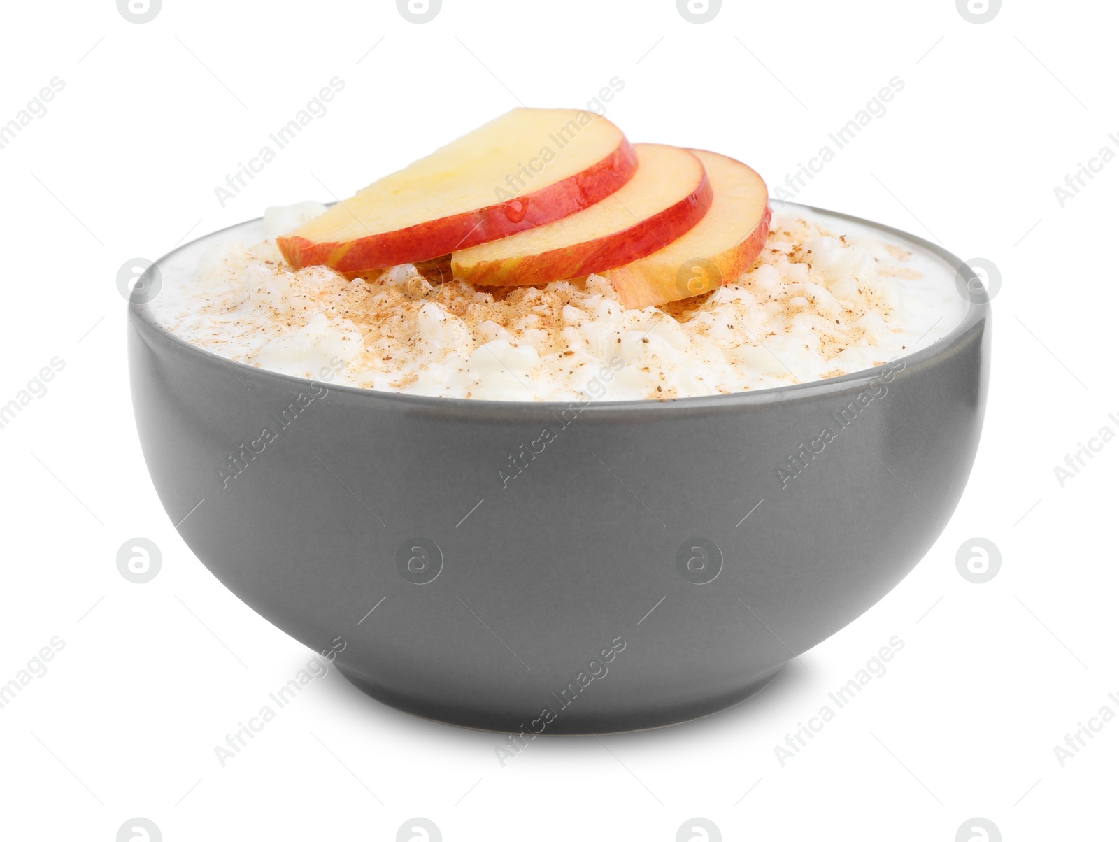 Photo of Delicious rice pudding with apples and cinnamon isolated on white