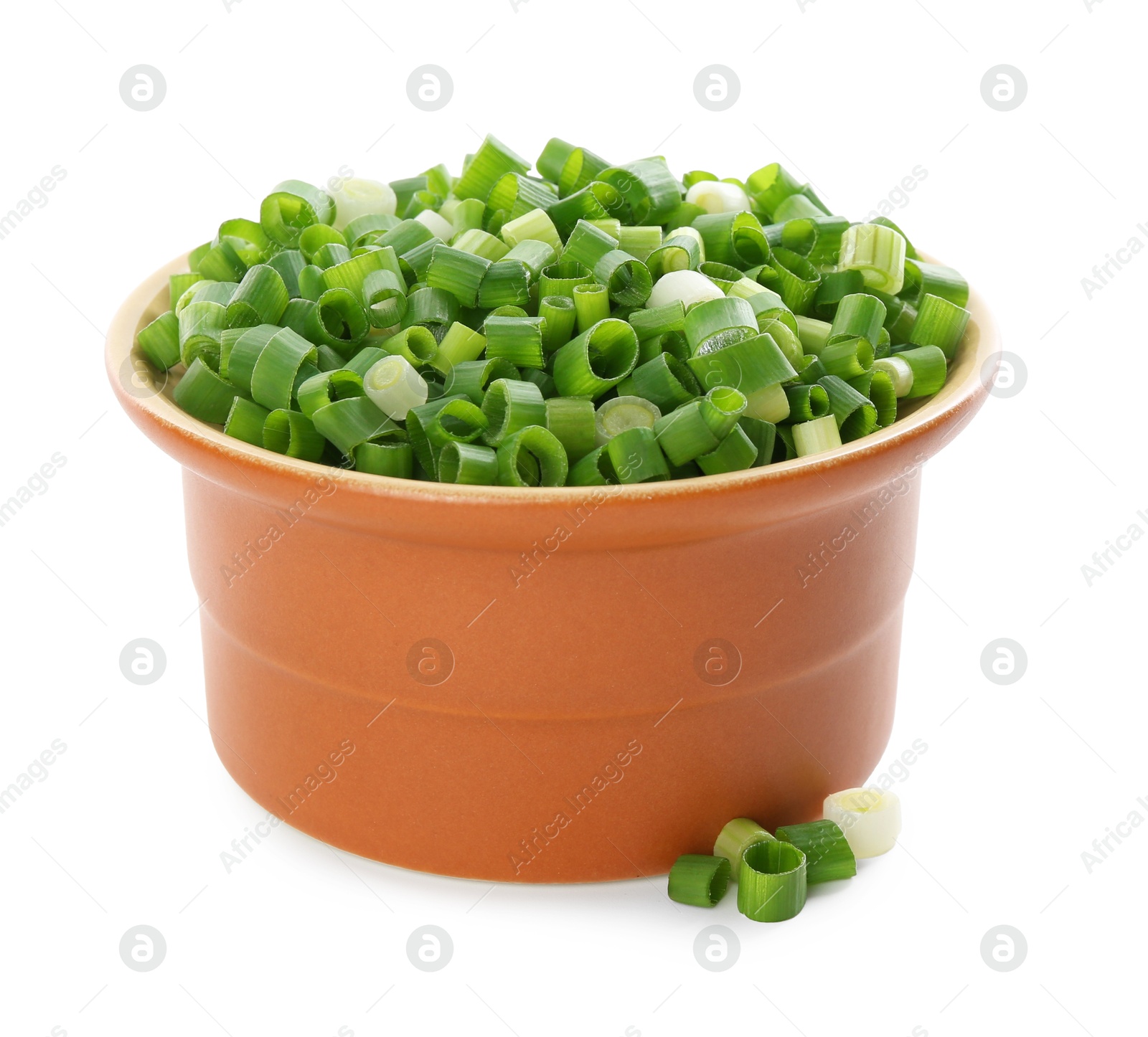 Photo of Chopped fresh green onion in bowl isolated on white