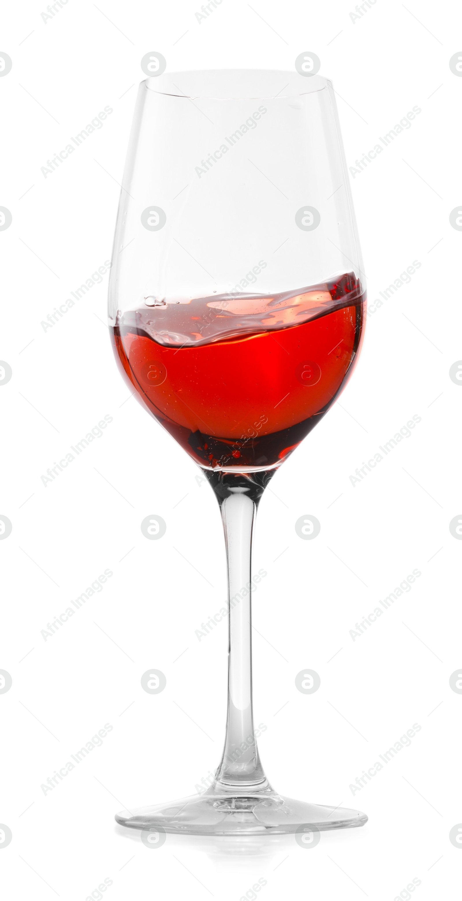 Photo of Rose wine splashing in glass on white background