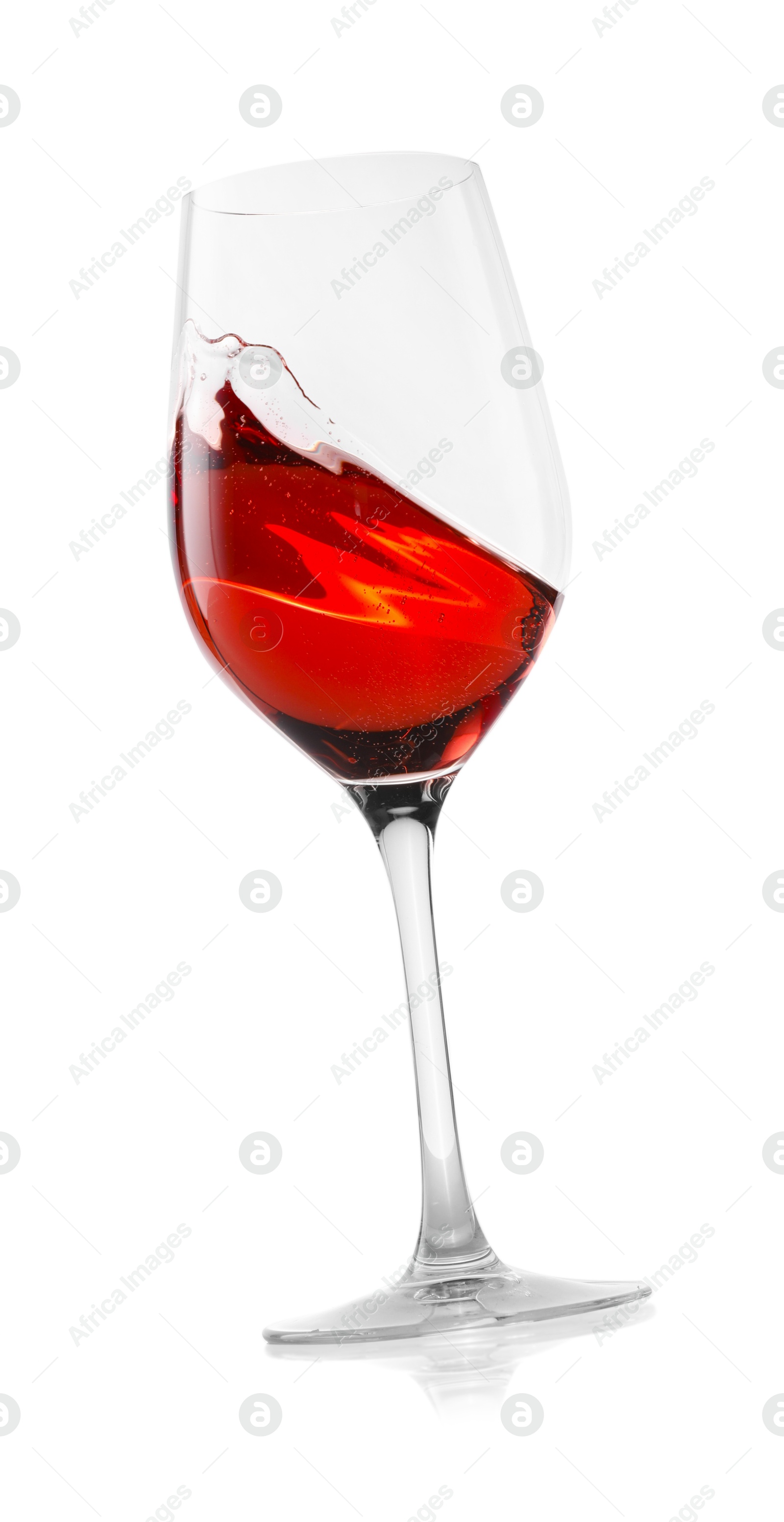 Photo of Rose wine splashing in glass on white background