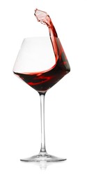 Photo of Red wine splashing in glass on white background