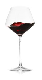 Photo of Red wine splashing in glass on white background