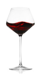 Photo of Red wine splashing in glass on white background