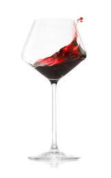 Photo of Red wine splashing in glass on white background