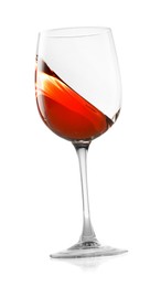 Photo of Rose wine splashing in glass on white background