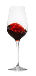 Photo of Red wine splashing in glass on white background