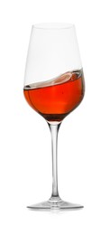 Photo of Rose wine splashing in glass on white background