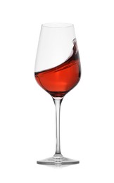 Photo of Rose wine splashing in glass on white background