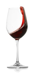 Photo of Red wine splashing in glass on white background