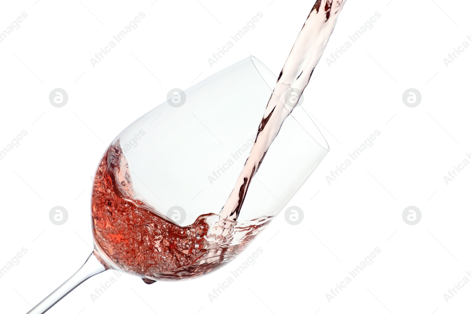 Photo of Pouring rose wine into glass on white background