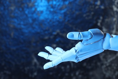 Photo of Artificial intelligence. Robot hand gesturing on blurred background, space for text