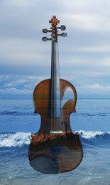 Image of Violin and beautiful seascape, double exposure. Inspiring or relaxing power of music