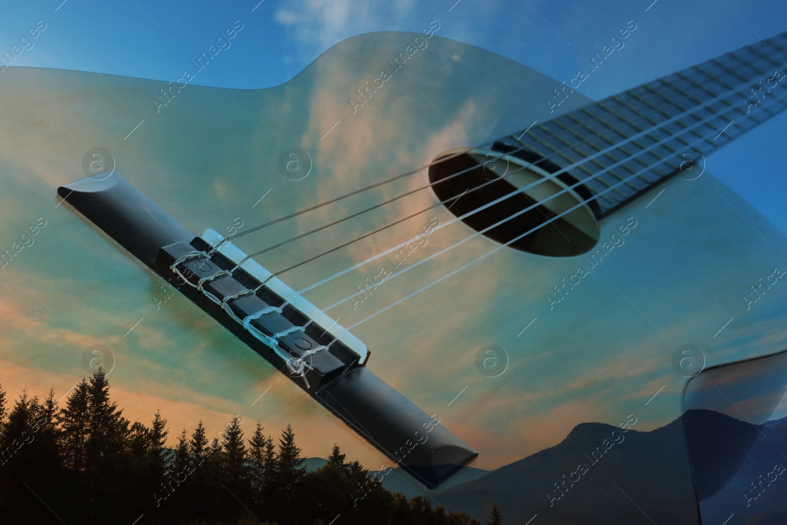 Image of Acoustic guitar and beautiful mountain landscape, double exposure. Inspiring or relaxing power of music