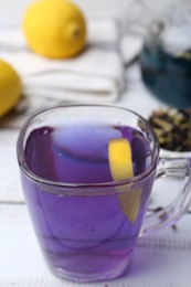 Delicious butterfly pea flower tea on wooden, closeup