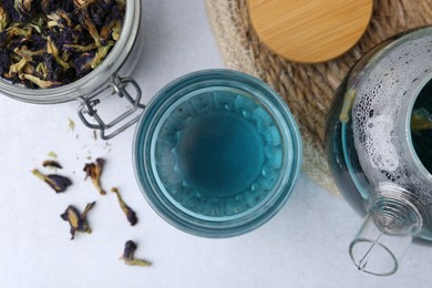 Photo of Delicious butterfly pea flower tea on light table, flat lay