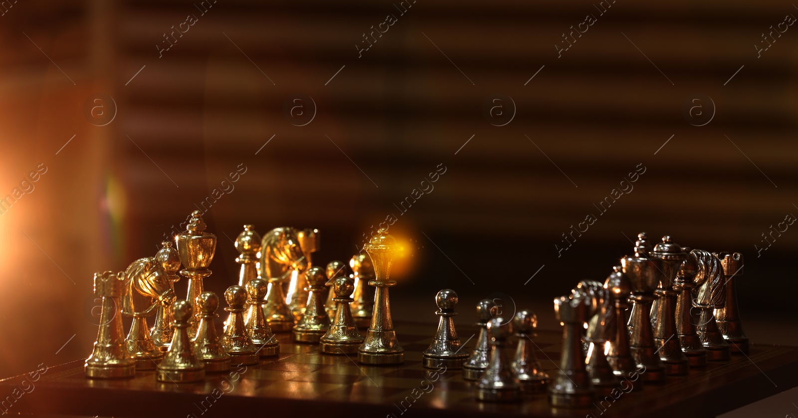 Image of Glowing queen among chess pieces on wooden chessboard, banner design