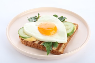 Photo of Plate of tasty sandwich with heart shaped fried egg isolated on white