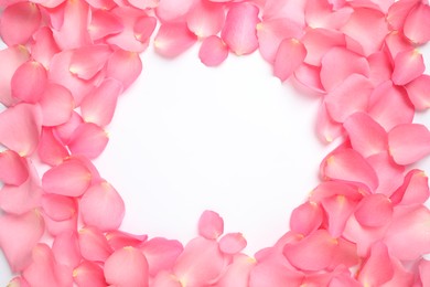 Photo of Frame made of pink rose petals on white background, top view