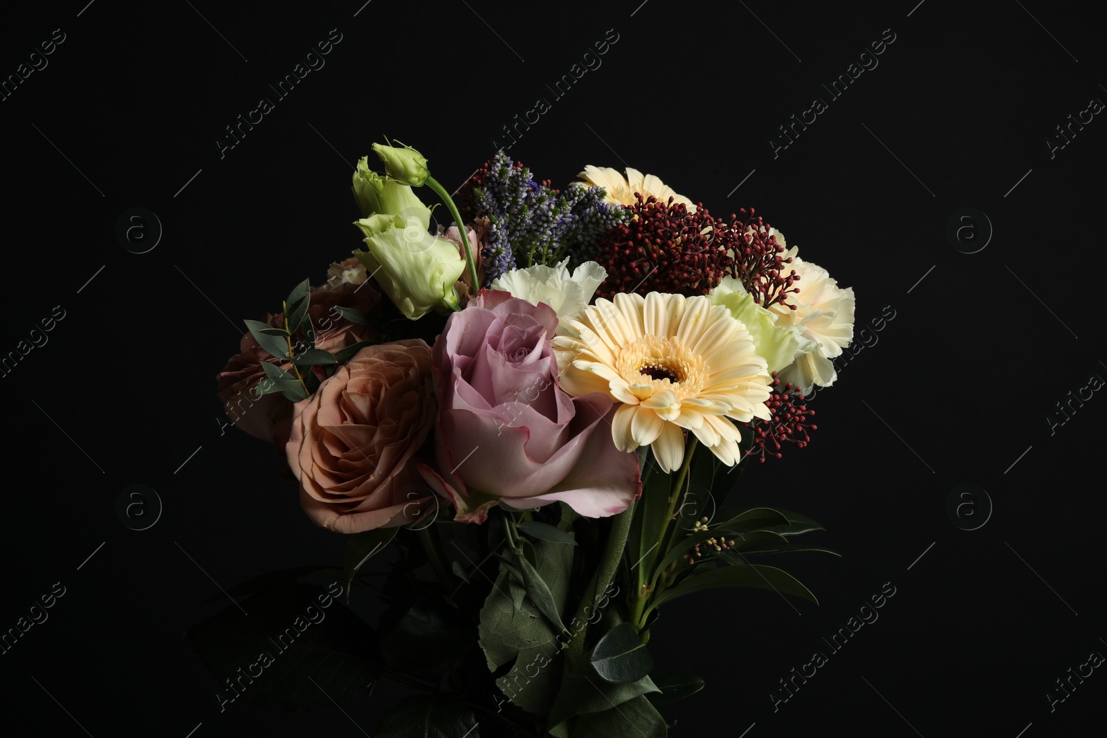 Photo of Bouquet of beautiful flowers on black background