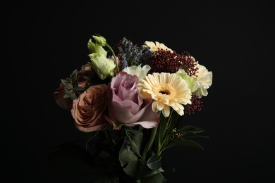 Photo of Bouquet of beautiful flowers on black background