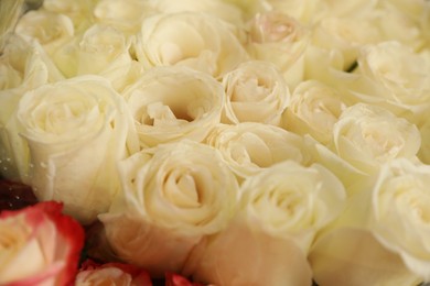 Photo of Beautiful bouquet of fresh roses, closeup. Floral decor