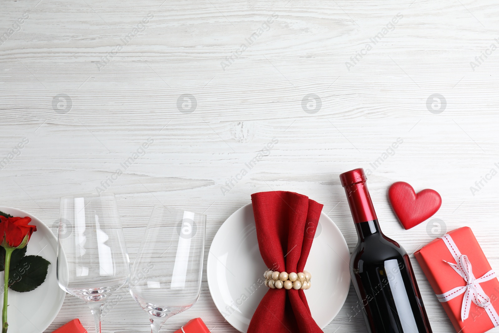 Photo of Elegant table setting on white wooden background, flat lay with space for text. Valentine's day romantic dinner