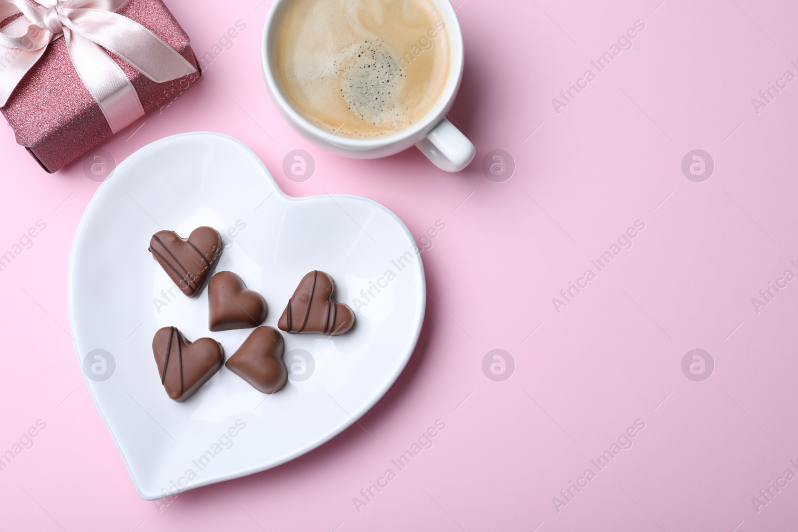 Photo of Romantic breakfast on pink background, flat lay with space for text. Valentine's day celebration