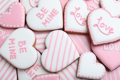 Photo of Delicious heart shaped cookies as background, top view. Valentine's Day