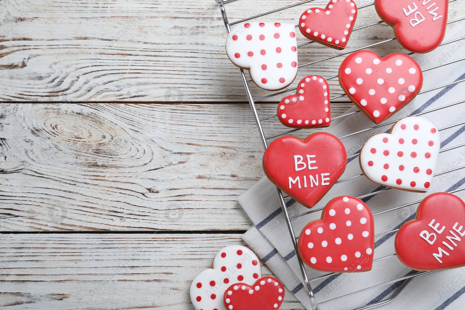 Photo of Heart shaped cookies on white wooden table, flat lay with space for text. Valentine's day treat