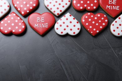 Photo of Valentine's day cookies on grey table, flat lay. Space for text