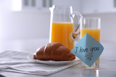 Photo of Romantic breakfast with note saying I Love You on table