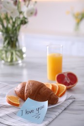 Photo of Romantic breakfast with note saying I Love You on table