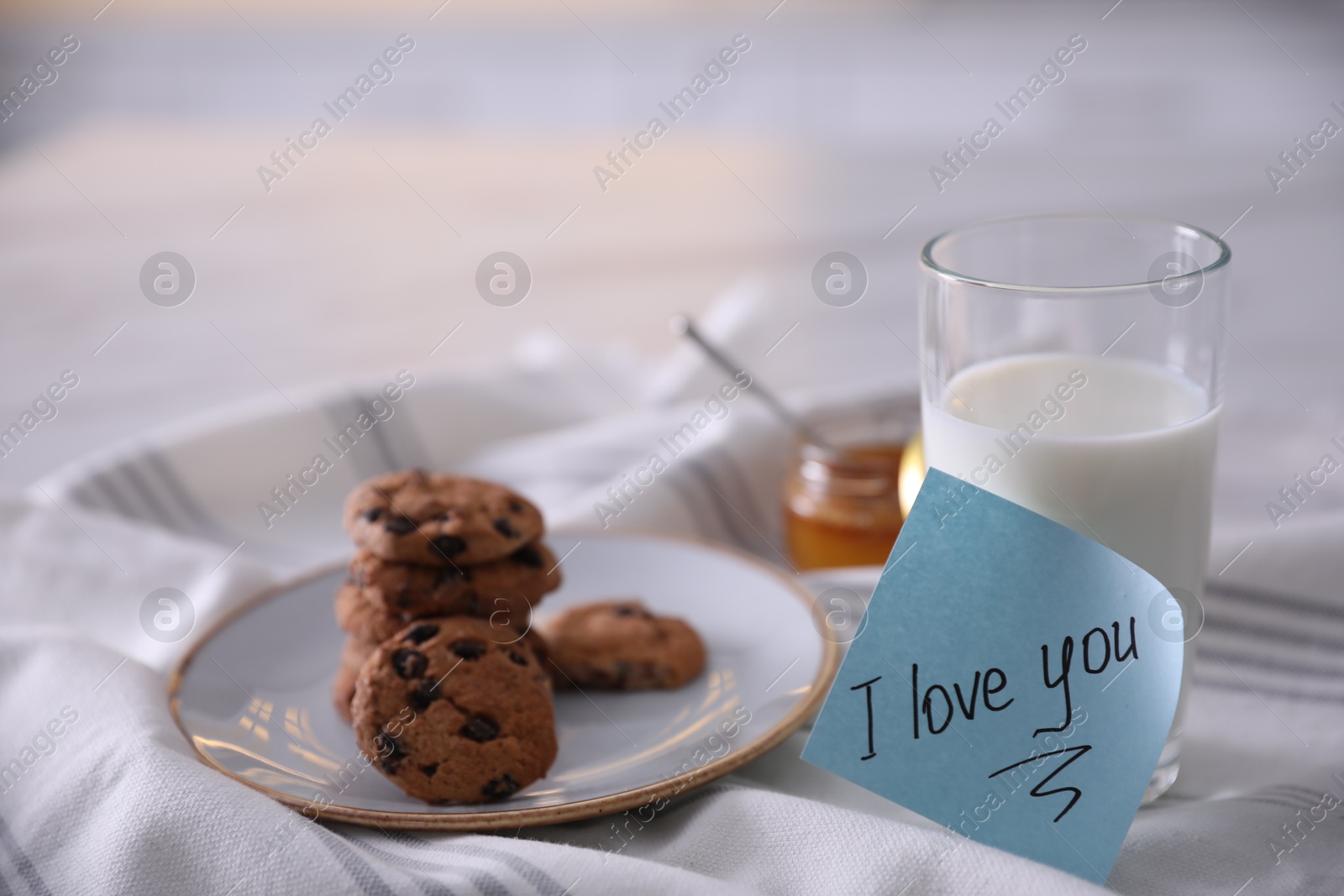 Photo of Romantic breakfast with note saying I Love You on table