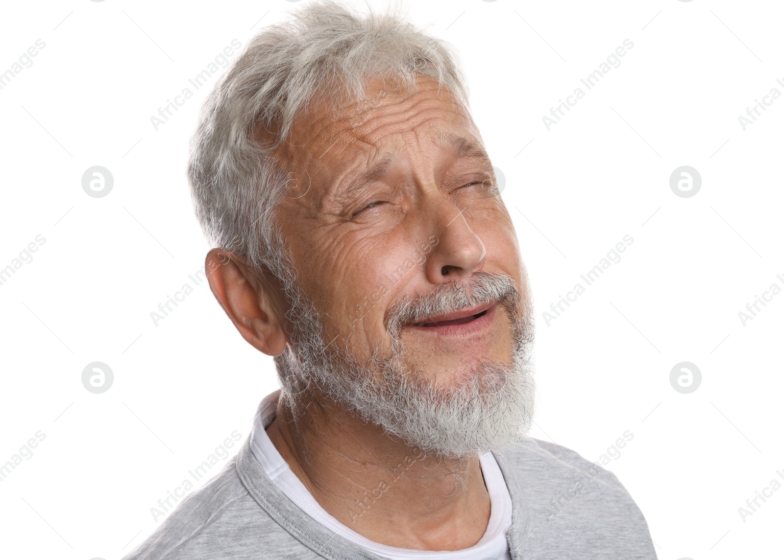 Photo of Sad senior man crying on white background