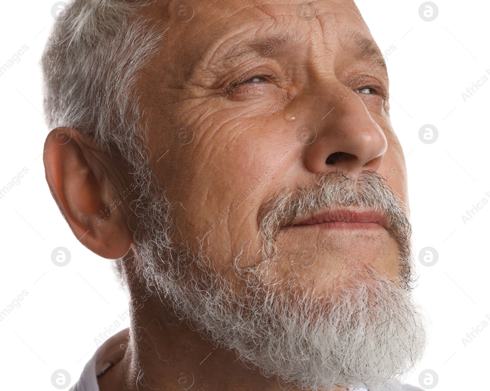 Photo of Sad senior man crying on white background, closeup