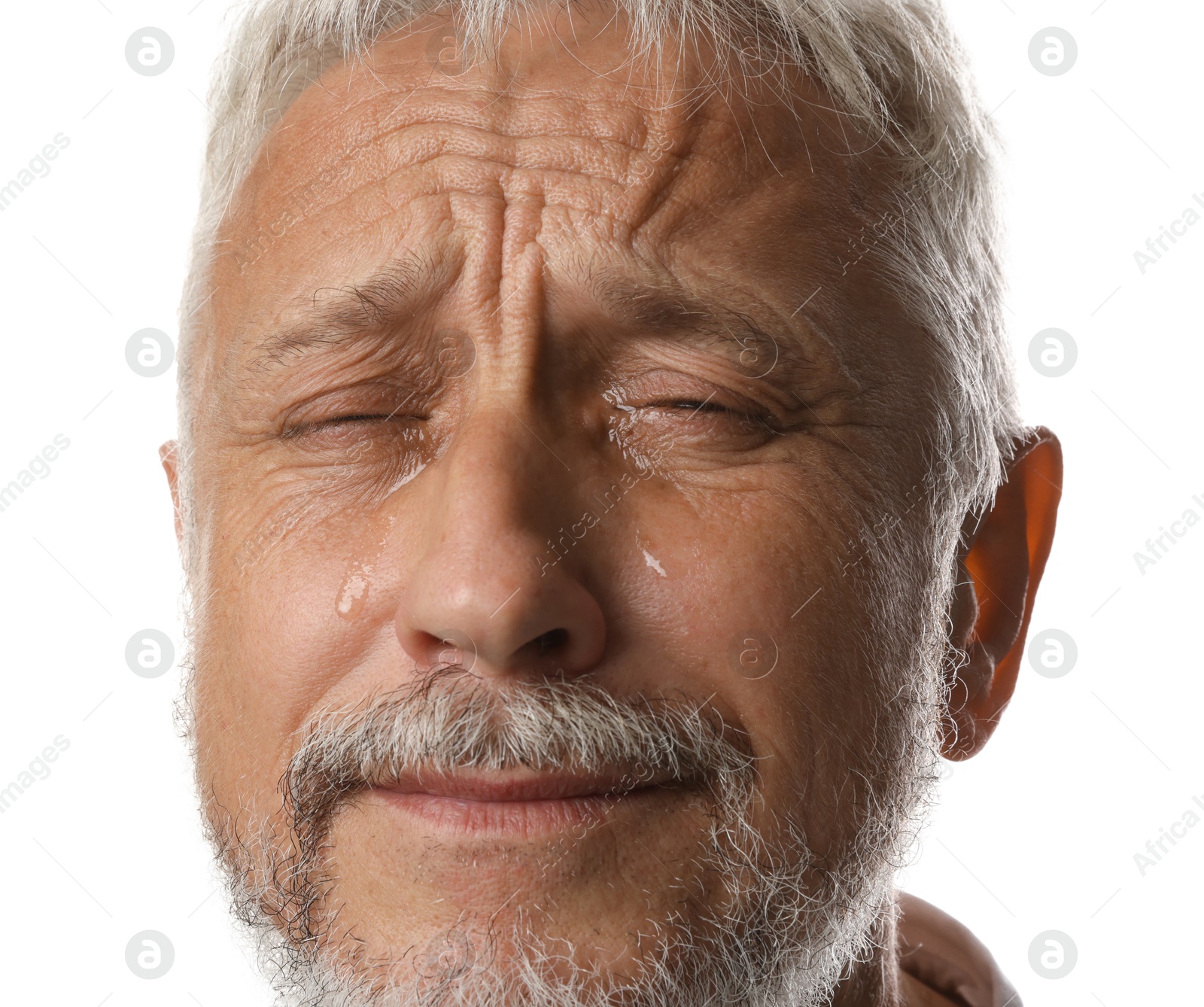 Photo of Sad senior man crying on white background, closeup