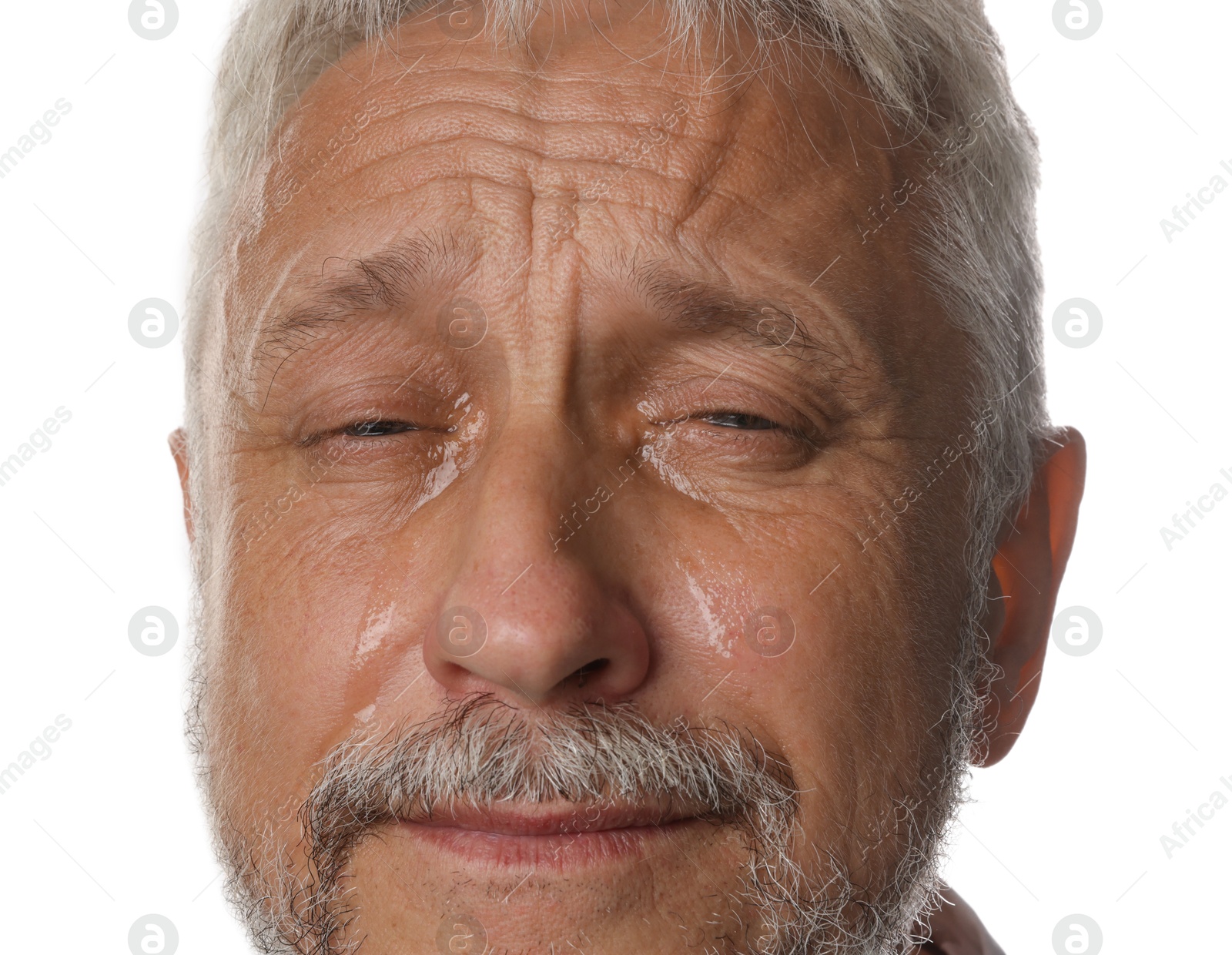 Photo of Sad senior man crying on white background, closeup