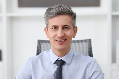 Photo of Portrait of businessman in shirt at workplace