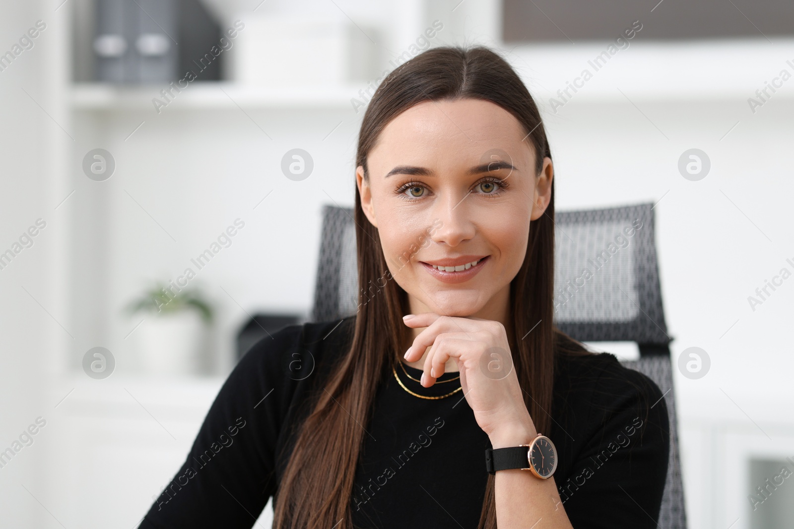 Photo of Portrait of happy beautiful businesswoman in office